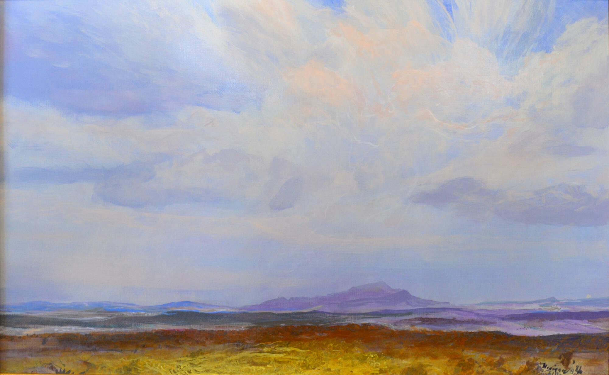 Landscape painting with a narrow horizontal band of yellow and red land. Blue and purple sky with clouds dominates the image.